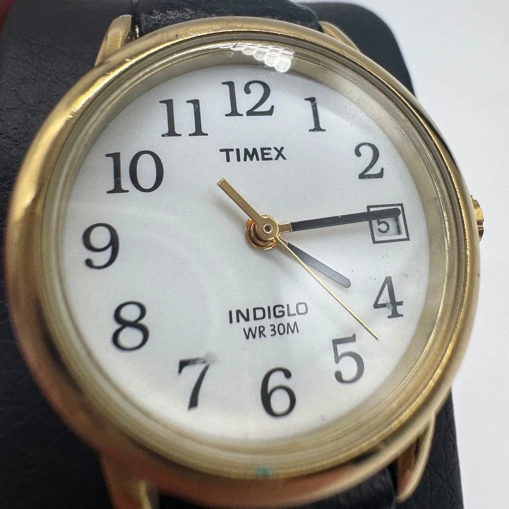 Timex Indiglo WR 30M Gold Tone White Dial Black Leather Watch CR 1216 needs bat